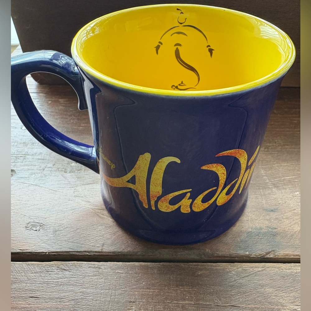 Broadway DISNEY Coffee Mug ALADDIN NAVY Yellow Inside Genie with lamp Inside